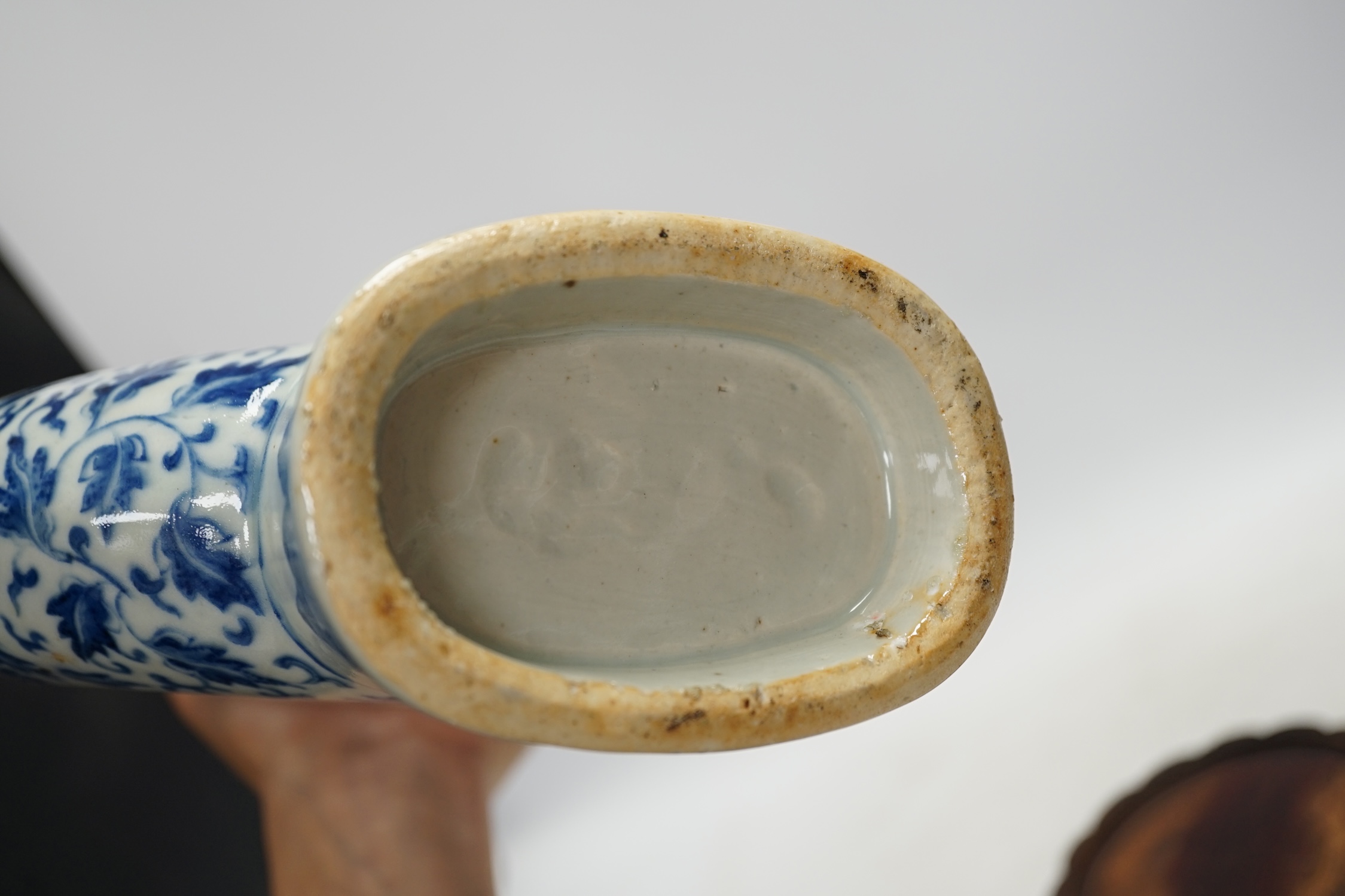 A 19th century Chinese blue and white moon flask on a hardwood stand, overall 35cm high. Condition - typical minor glaze imperfections